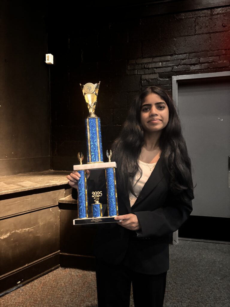 Anvitha with a trophy at the NCFL National Tournament